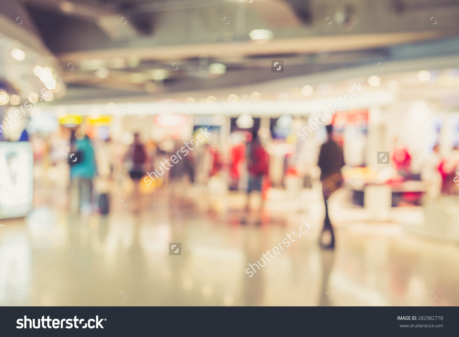 stock-photo-blurred-image-of-people-in-shopping-mall-with-bokeh-vintage-color-282982778